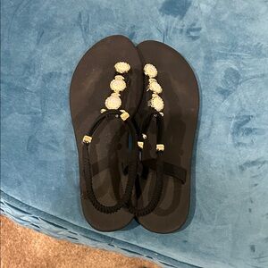 Chic Black Sandals with Gold Embellishments